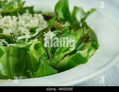 Spring salad with herbs, dandelion, nettle Stock Photo