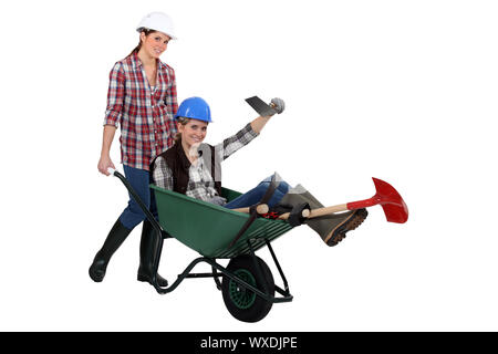 duo of female bricklayers Stock Photo