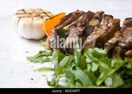 shashlik with potherbs on the plate Stock Photo