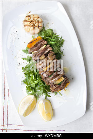 shashlik with potherbs on the plate Stock Photo