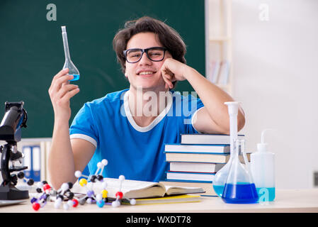 Young male student in the classroom Stock Photo