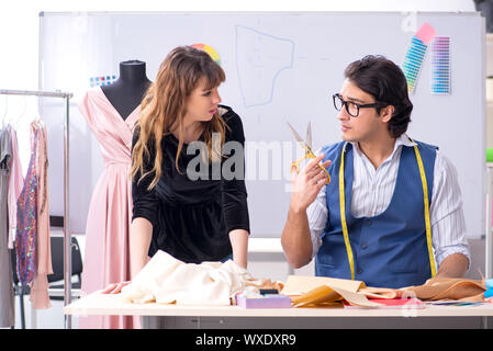 Young tailors working in workshop Stock Photo