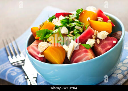 Bowl of roasted sliced red and golden beets Stock Photo