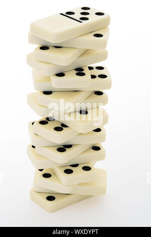 Tower from bones of a dominoes with black points Stock Photo