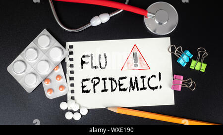 Flu Epidemic. Medicines, red stethoscope and stationery Stock Photo