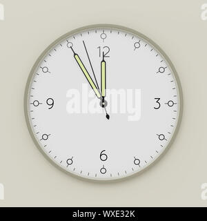 a clock shows five minutes to noon Stock Photo