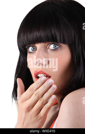 Young woman staring in shock Stock Photo
