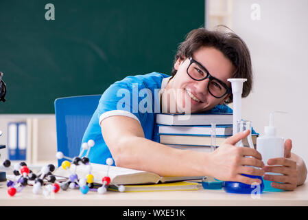 Young male student in the classroom Stock Photo