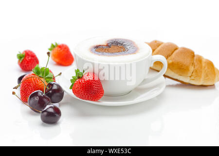 cappuccino in a cup in the shape of hearts,cherry,croissant  and strawberries isolated on white Stock Photo
