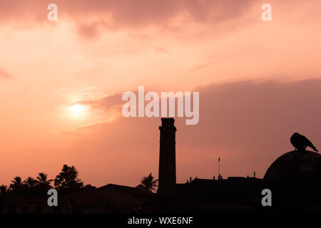 sunset with clock tower gall sri lanka Stock Photo