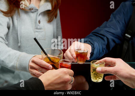 Drinking a variety of alcoholic beverages in the campaign of friends Stock Photo