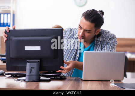 Young male it specialist in the office Stock Photo