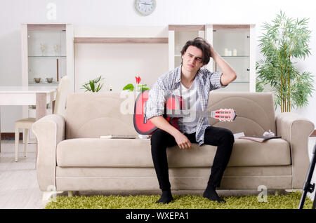Young guitar player recording video for his blog Stock Photo
