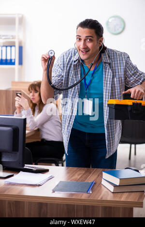 Young male it specialist in the office Stock Photo