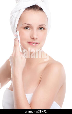 Close-up portrait of young woman with perfect health skin of face, bath towel on head and clean sponge. Isolated on white Stock Photo