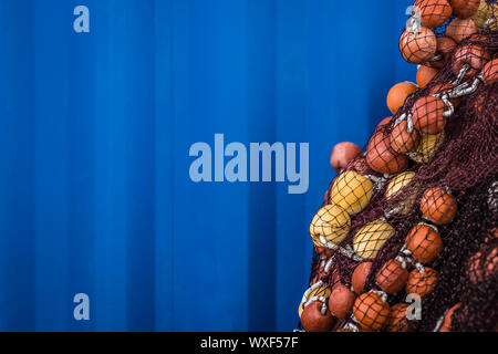 Fisherman fishing nets with blue background Stock Photo