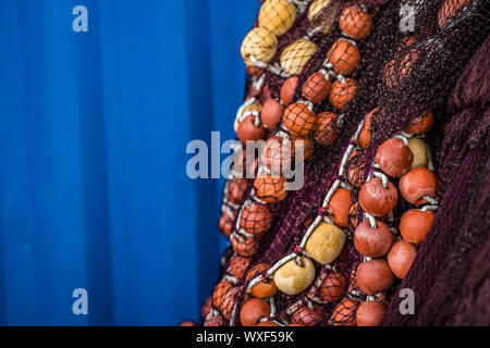 Fisherman fishing nets with blue background Stock Photo