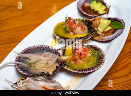 fresh scallops new peruvian cuisine style Stock Photo