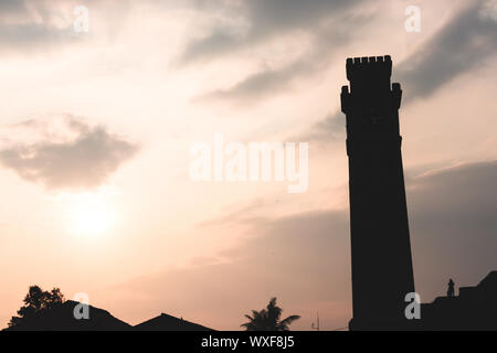 sunset with clock tower gall sri lanka Stock Photo