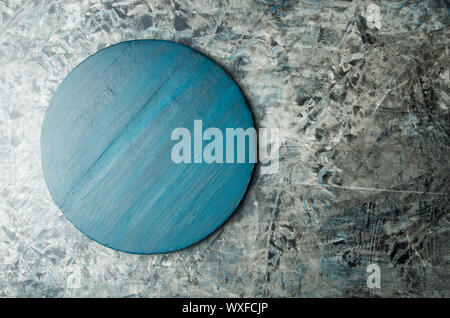 TEXTURE OF BLUE WOODEN BOARD ON SULFUR BACKGROUND. GRAY WOODEN INNOVATIVE BOARD ON DARK SURFACE. Stock Photo