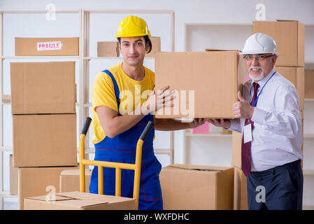 Professional movers doing home relocation Stock Photo