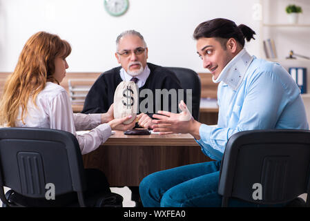 Young couple in the courthouse in divorce concept Stock Photo