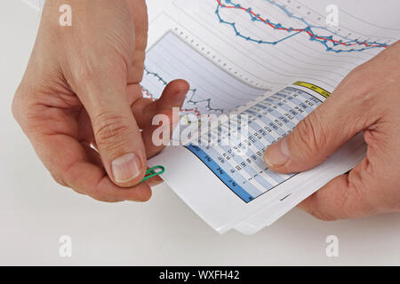 Graphs tables and documents laid on the table Stock Photo