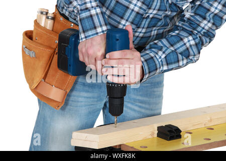 Man using a cordless drill Stock Photo