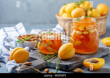 Apricot jam with thyme and almonds. Stock Photo