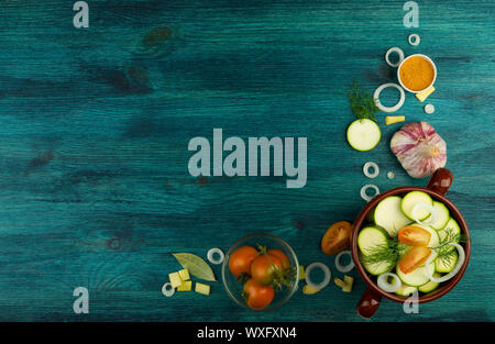 VEGETABLES ON BACKGROUND. FRESH VEGETABLES AND SPICES ON A WOODEN SURFACE. COPY SPACE Stock Photo