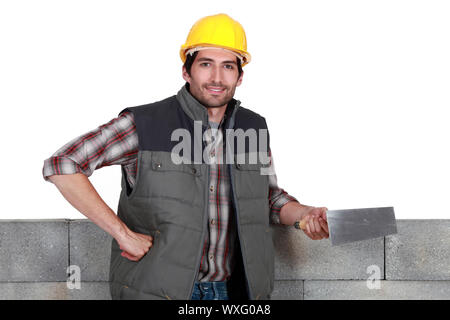 mason holding a trowel Stock Photo