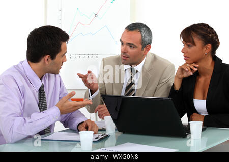 A businessteam working on a project. Stock Photo