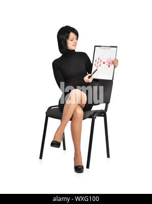 businesswoman sitting on chair with business formula on clipboard Stock Photo