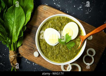 Green sorrel. Fresh sorrel leaves on a dark surface. View from above. Copy space Stock Photo