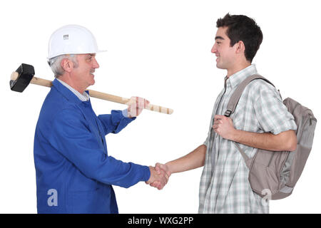 Tradesman meeting new apprentice Stock Photo