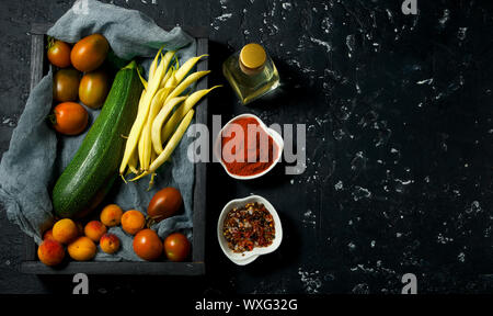 Vegetables on a dark background. Spices Stock Photo