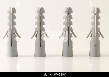 four standing rawlplugs on white background Stock Photo