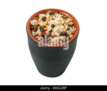 A mixture of seasonings in a bowl isolated on a white background. Spice on isolate. View from above. Stock Photo