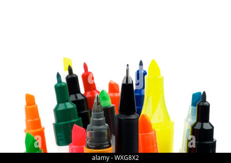 Heap of Uncapped Multi Colored Felt Tip Pens, Highlighters and Liner Pens in a Row isolated on white background Stock Photo