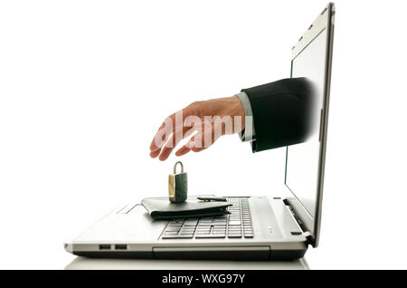 Male hand coming out of laptop monitor trying to steal ones wallet only to find it under padlock. Stock Photo