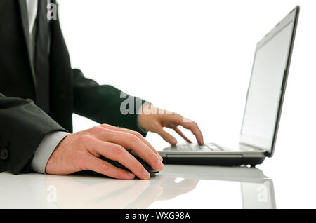 Close up of business man working on laptop. Isolated over white background. Stock Photo