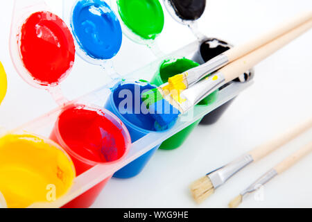 Water based paints and brush, isolated on a white background Stock Photo