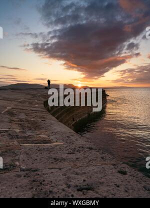 Lyme Regis, Dorset, UK. 17th September 2019. UK Weather. Stunning sunrise on the south coast. Credit: DTNews/Alamy Live News Stock Photo