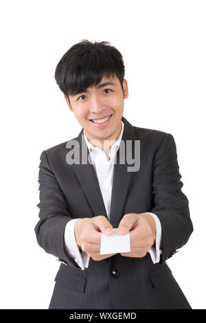Asian businessman show you a blank business card, closeup portrait on white background. Stock Photo