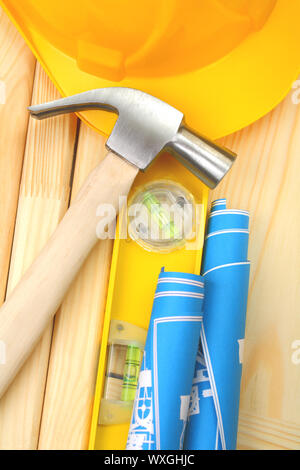 claw hammer construction level helmet rolled blueprints Stock Photo - Alamy