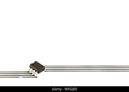 Design elements formed of an electronic chip and tracks printed on paper Stock Photo