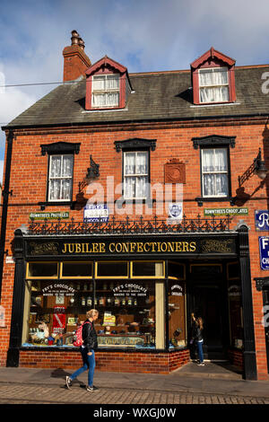 UK, County Durham, Beamish, Museum, Town, visitors outside Jubilee Confectioner’s shop Stock Photo