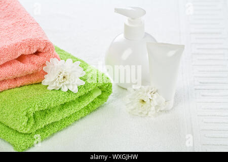 Accessories for bathing with flower on towel Stock Photo