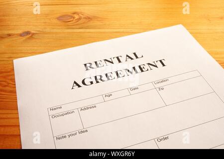 rental agreement form on desktop in business office showing real estate concept Stock Photo