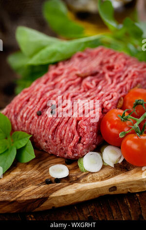 Cooking ingredients. Minced meat with tomato and spring onions. Stock Photo